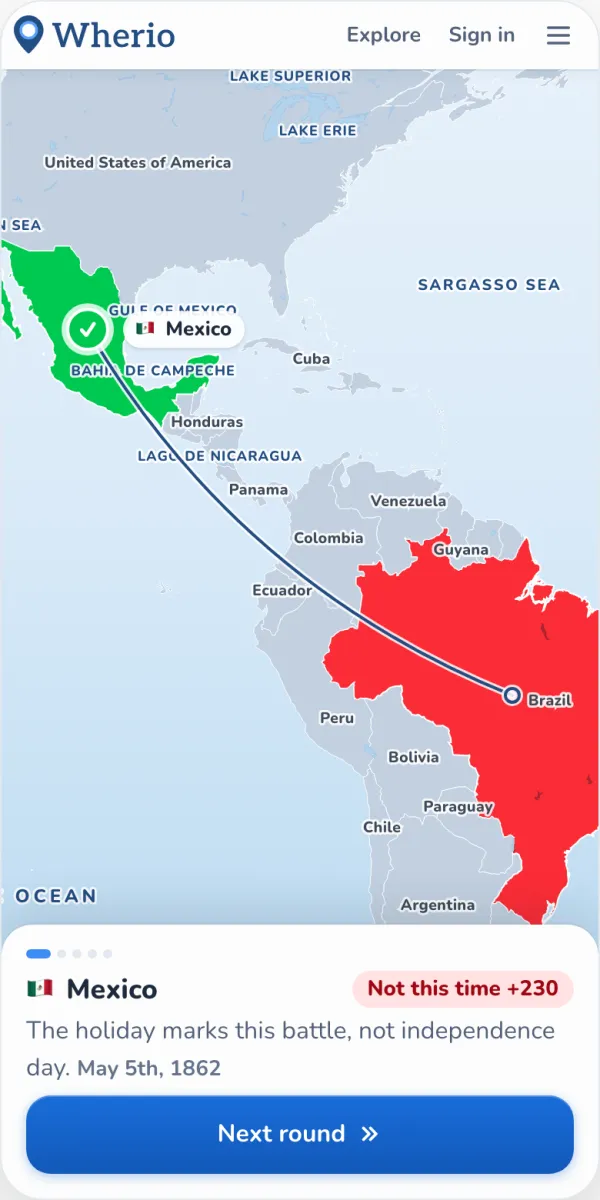 Wherio reveal screen: the answer, Mexico, is highlighted in green, a line runs to a guess in Brazil, and the panel explains the Battle of Puebla